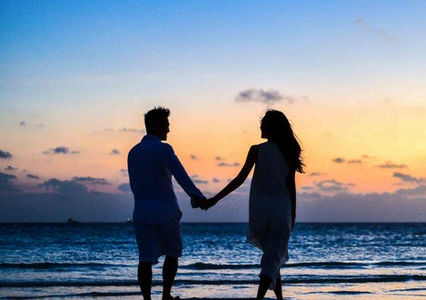 Couple on the beach at sunset
